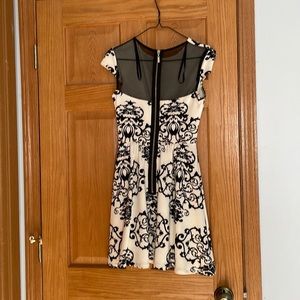 Black and white mini dress with mesh back